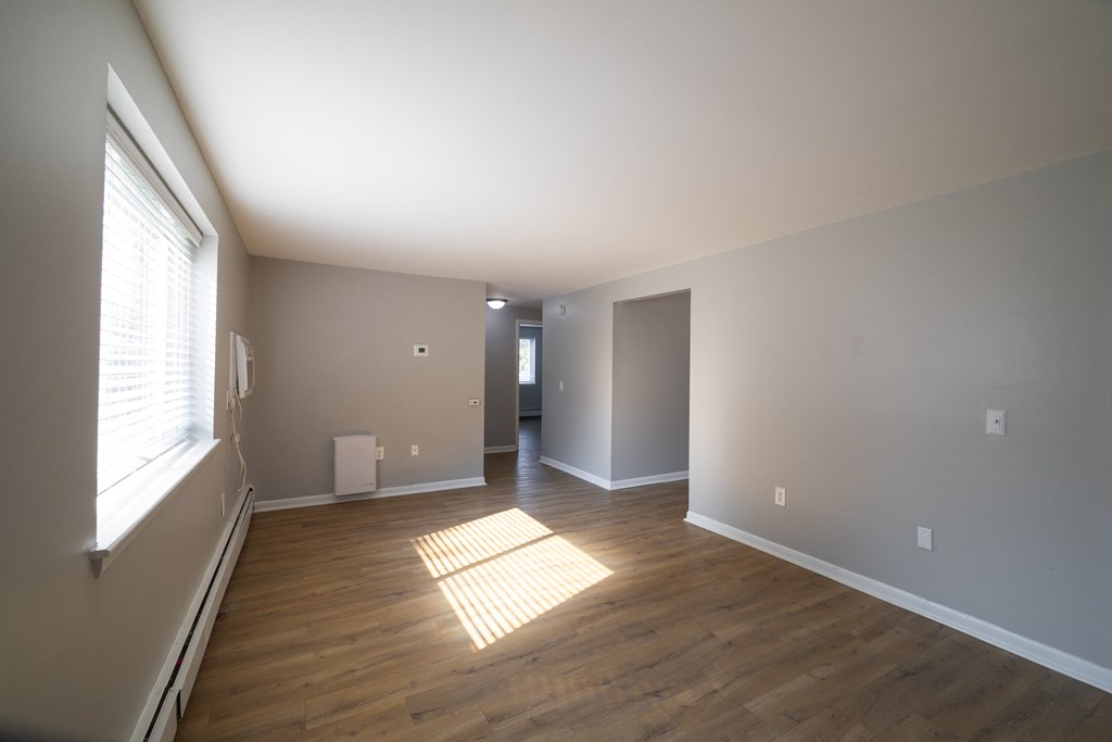 Renovated Living Room with window at Willowbrooke Apartments & Townhomes at 396 Willowbrooke Drive in Brockport, NY 14420