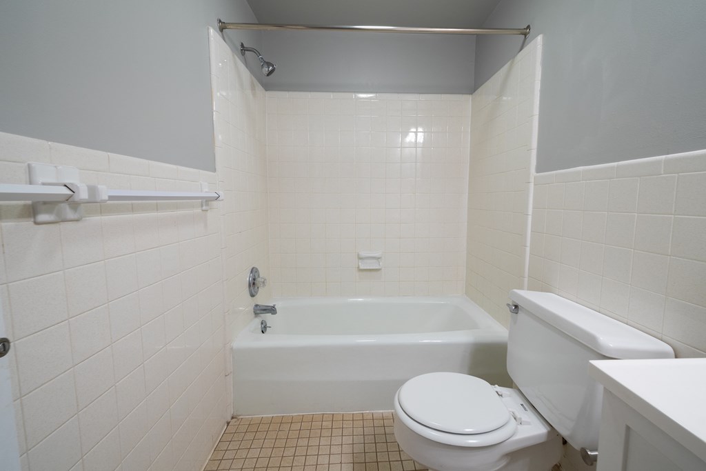 Updated Bathroom with bath tub at Willowbrooke Apartments & Townhomes at 396 Willowbrooke Drive in Brockport, NY 14420