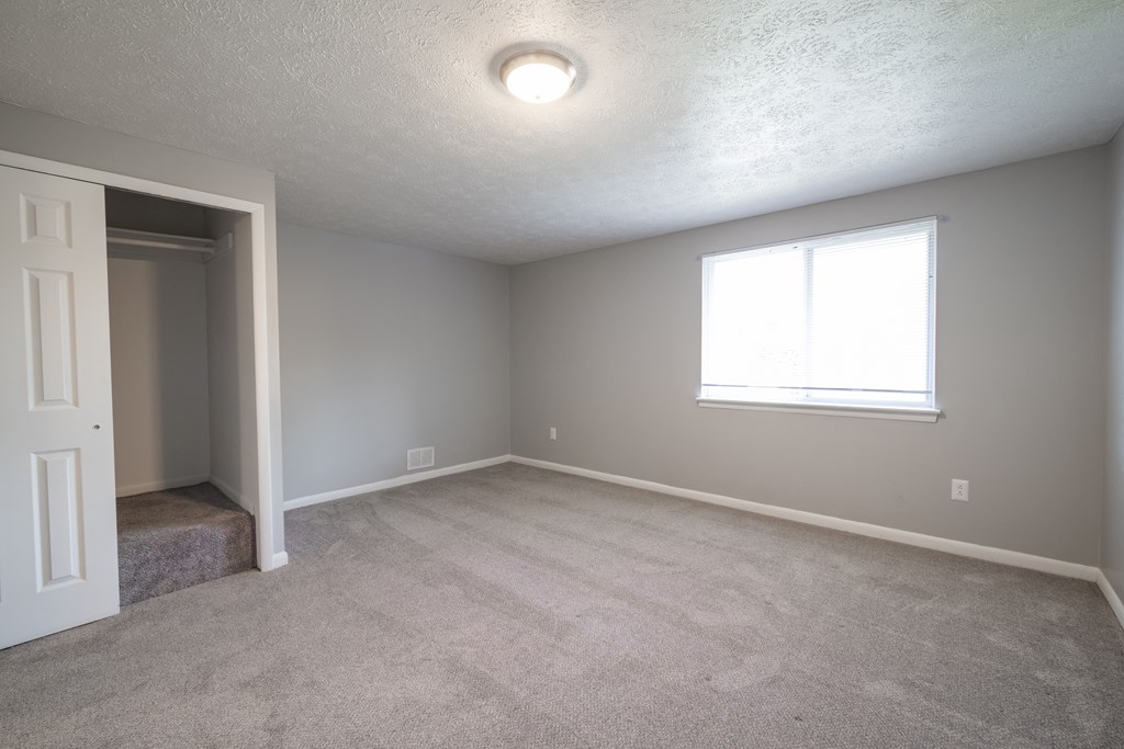 Renovated Bedroom with window view  at Willowbrooke Apartments & Townhomes at 396 Willowbrooke Drive in Brockport, NY 14420
