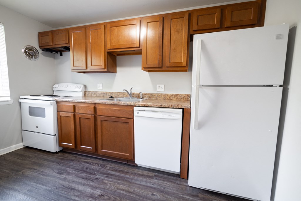 Kitchen with cabinets at Willowbrooke Apartments & Townhomes at 396 Willowbrooke Drive in Brockport, NY 14420