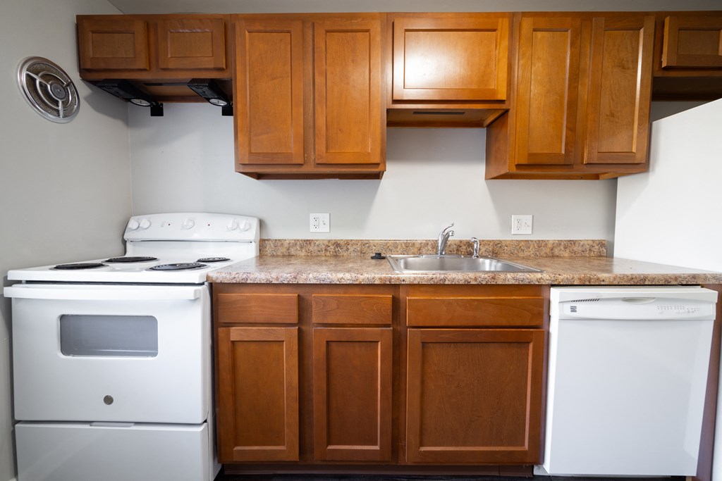 Kitchen with cabinets at Willowbrooke Apartments & Townhomes at 396 Willowbrooke Drive in Brockport, NY 14420