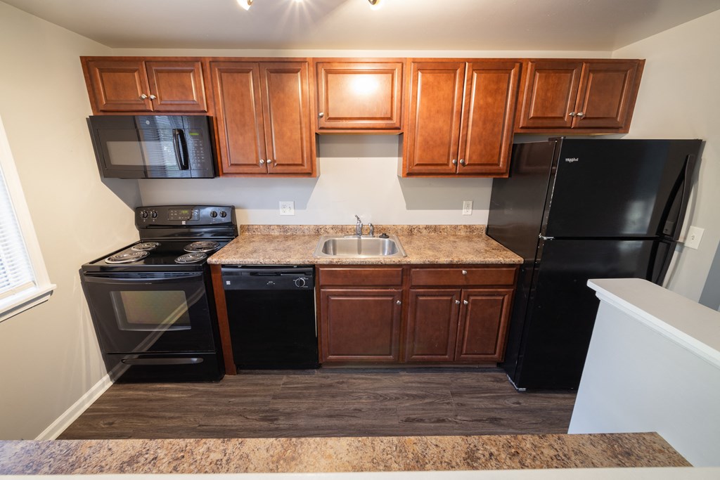 Updated Kitchen with Cabinets and appliances at Willowbrooke Apartments & Townhomes at 396 Willowbrooke Drive in Brockport, NY 14420