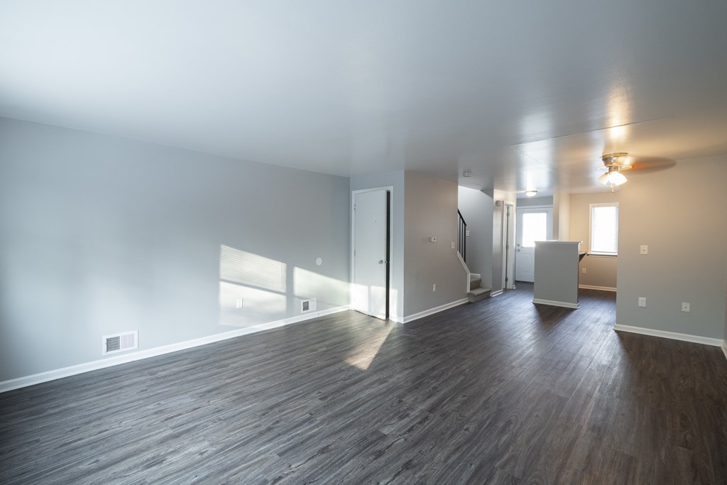 Renovated Living Room with wooden floor at Willowbrooke Apartments & Townhomes at 396 Willowbrooke Drive in Brockport, NY 14420
