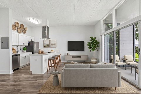 A modern living room with a grey couch and a television.