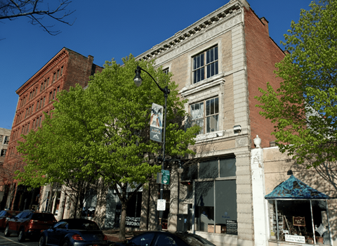 A street view of a building with a sign that says "CONSULT".