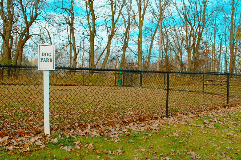a dog park sign on the side of a fence at Willowbrooke Apartments, Brockport, NY