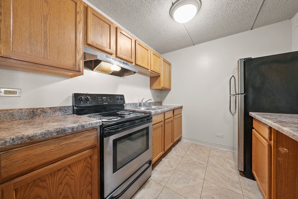 Upgraded Kitchen with cabinets at Woodland Ridge Apartments in Woodridge, IL