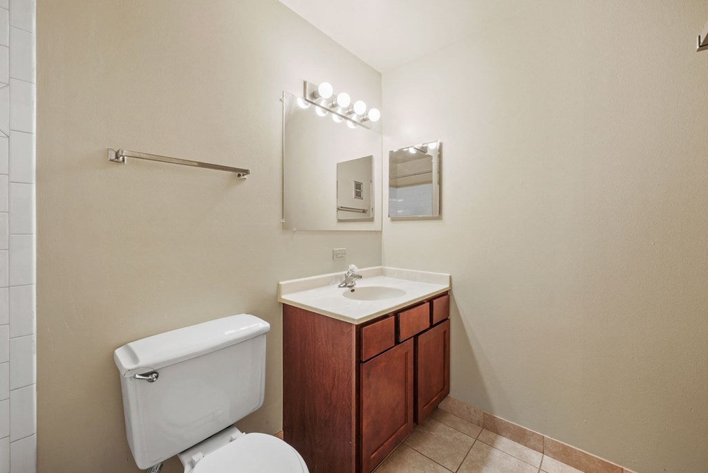 Bathroom with cabinets at Woodland Ridge Apartments in Woodridge, IL