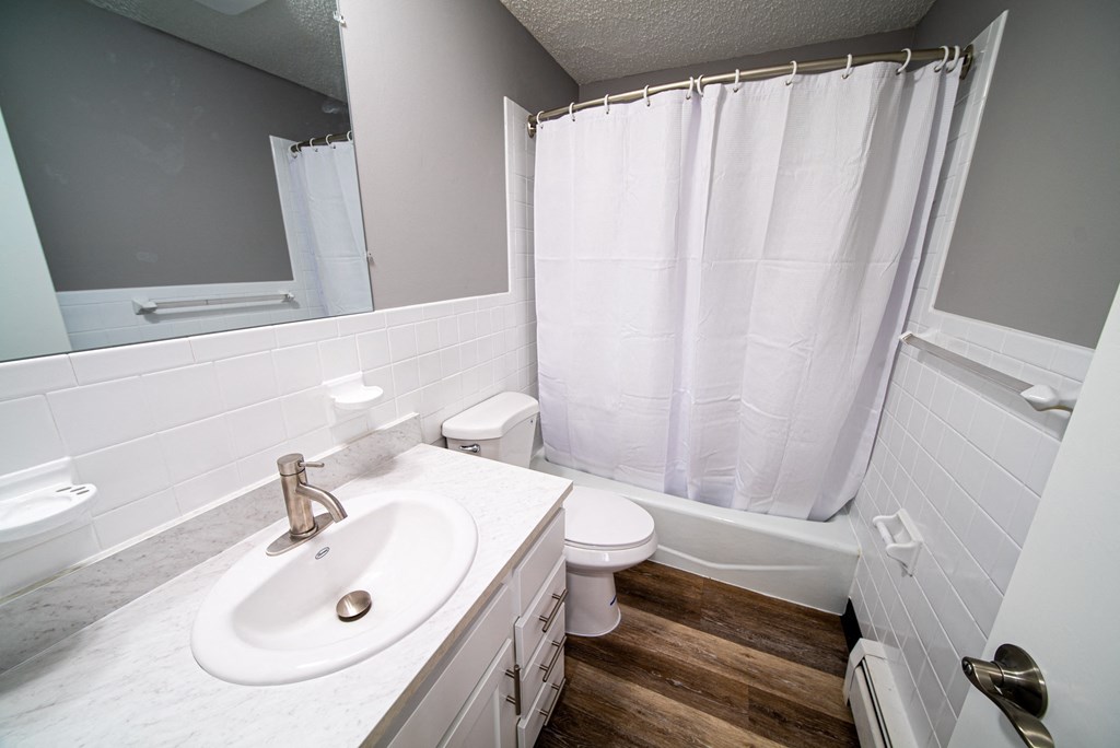 Renovated Apartment Home Bathrom at  Lincoln Square Apartments at 4055 Knoll Drive in Hamburg, NY