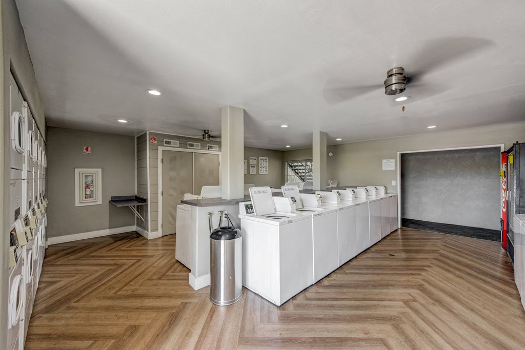 laundry room with washer and dryers