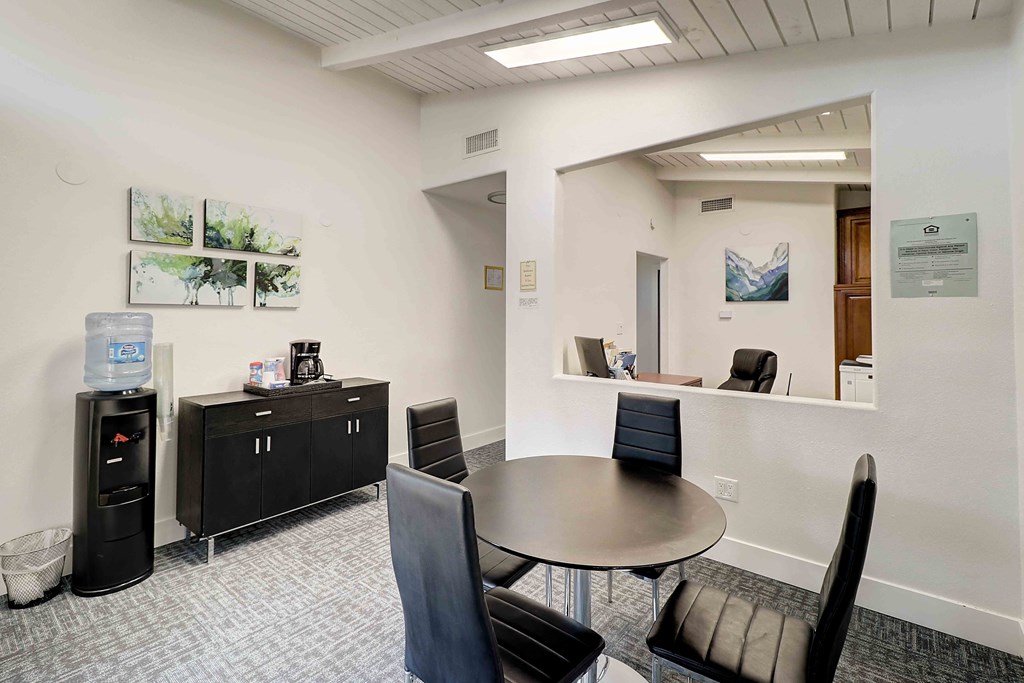 a conference room with a table and chairs