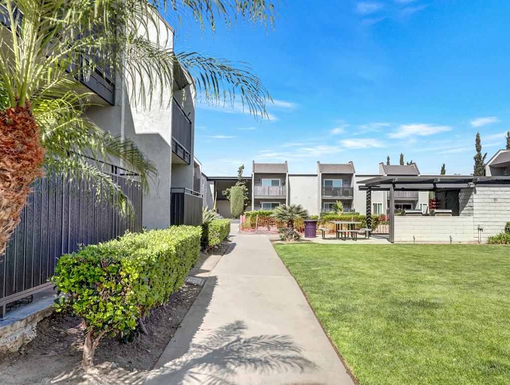 A sunny day at a residential area with a clear blue sky.
