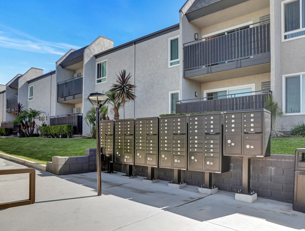 A building with a row of mailboxes in front of it.