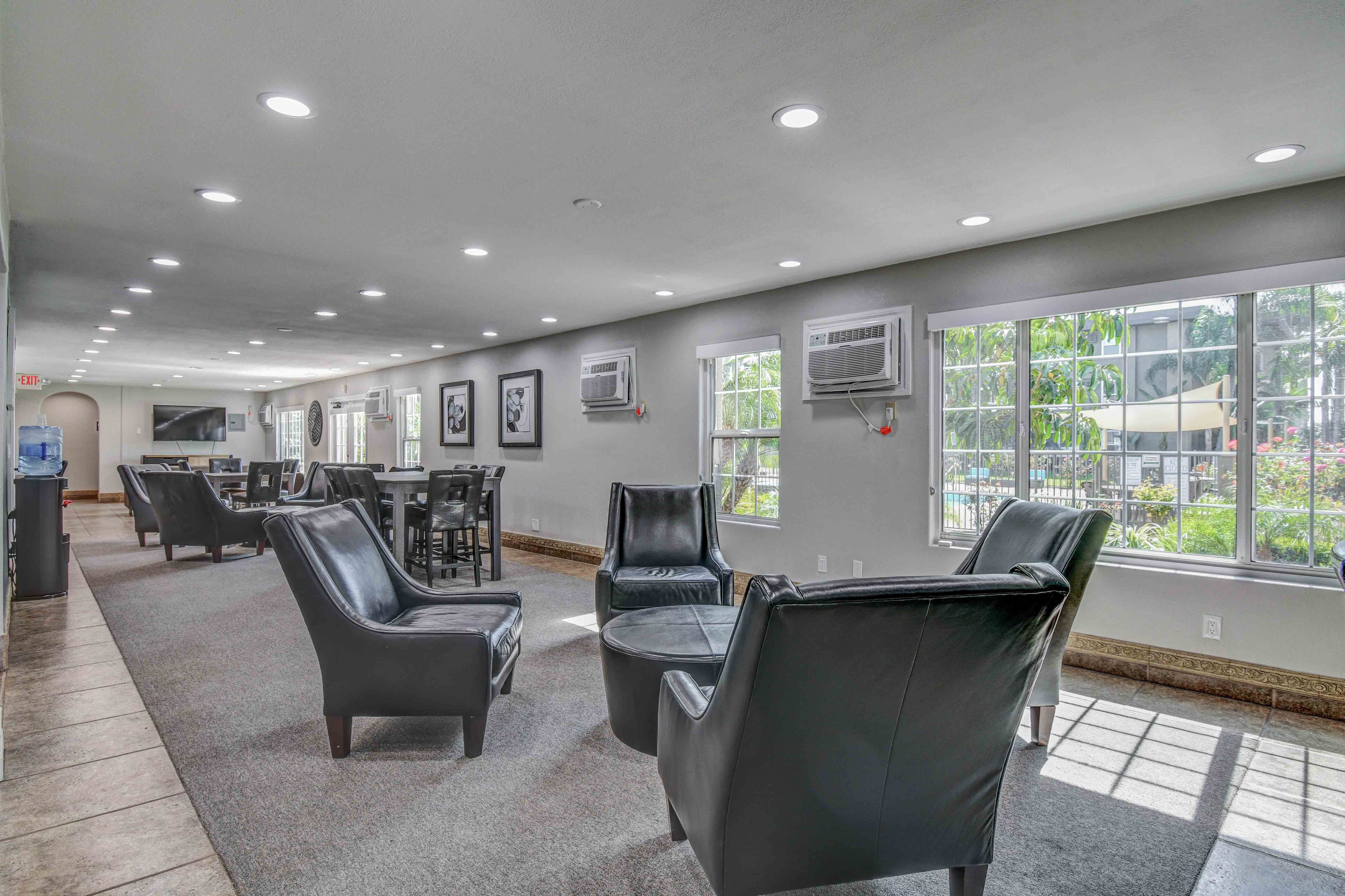 Recreation Room at Nutwood East with tables and chairs
