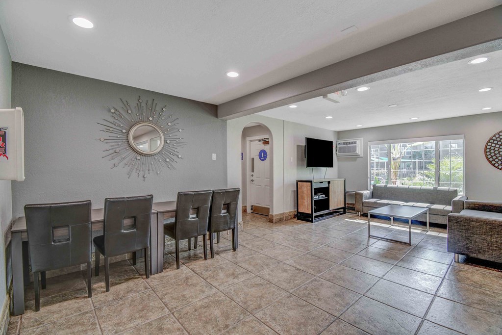 a dining room with a table and chairs