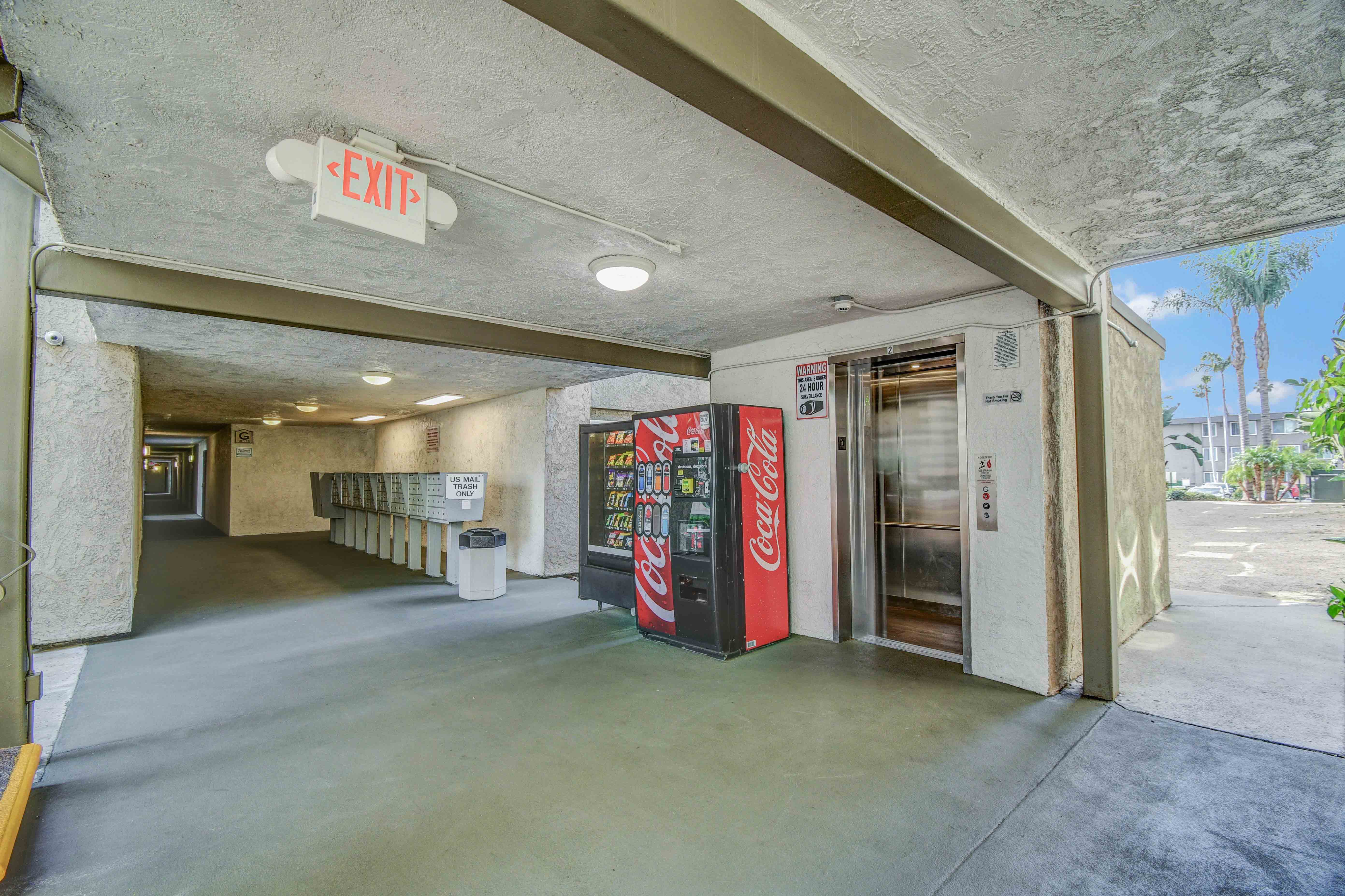 Center of the property with elevator, vending machines and Mail area