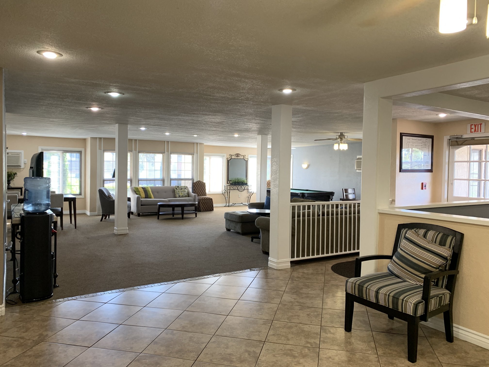 a large living room with a couch and a table