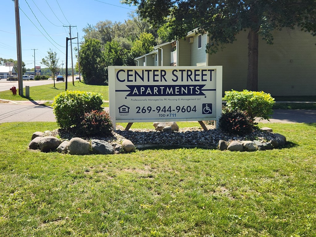 a sign for center street apartments