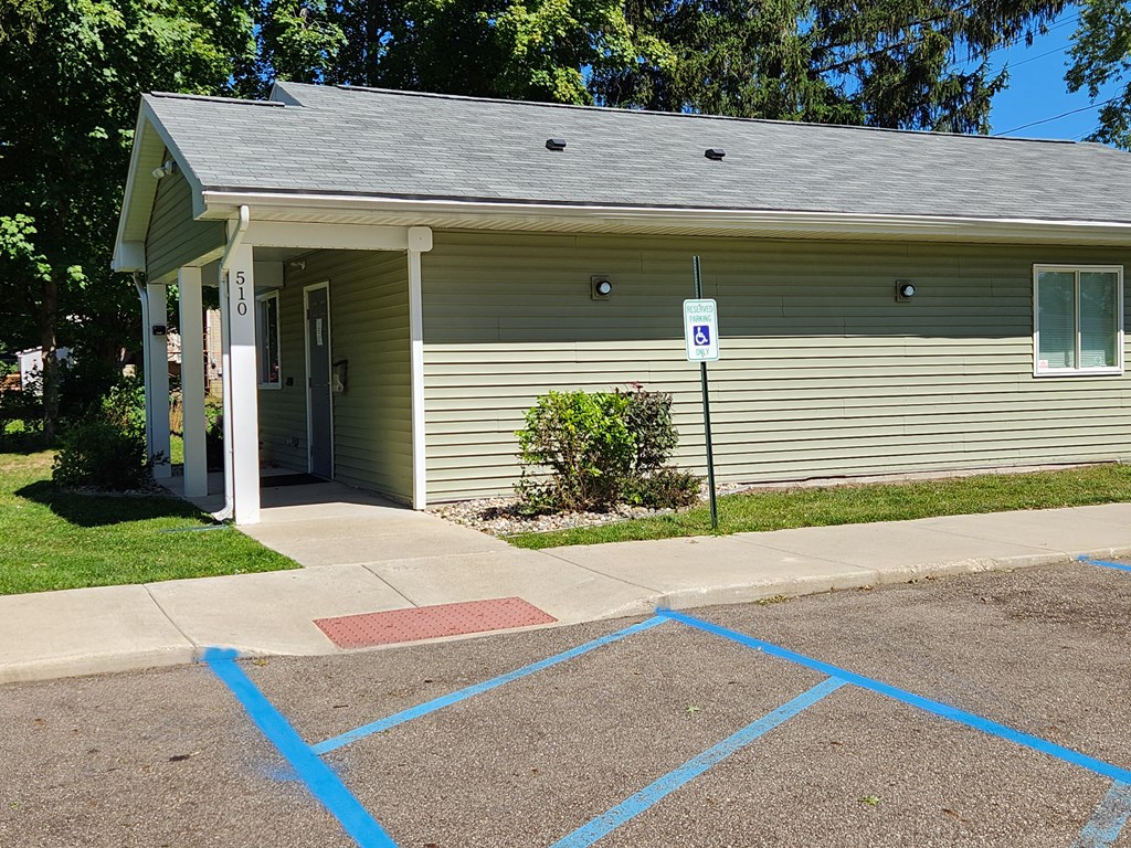 a building with a parking lot in front of it