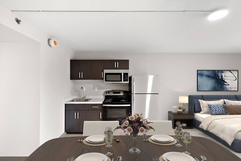 a kitchen and dining room with a table and chairs