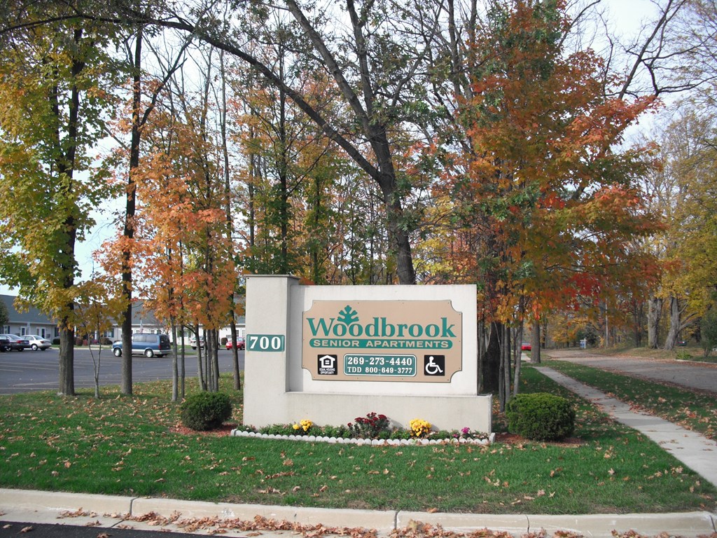 a photo of the sign at the entrance to woodbrook senior apartments