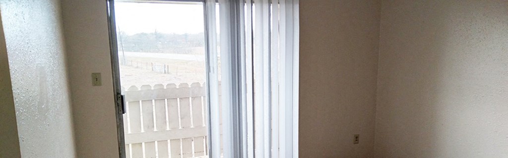 a window in a room with a view of a balcony