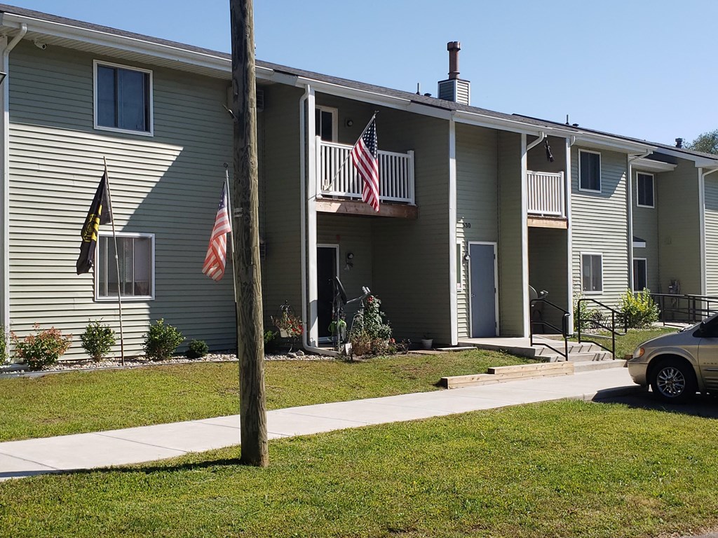 a building with two american flags in front of it