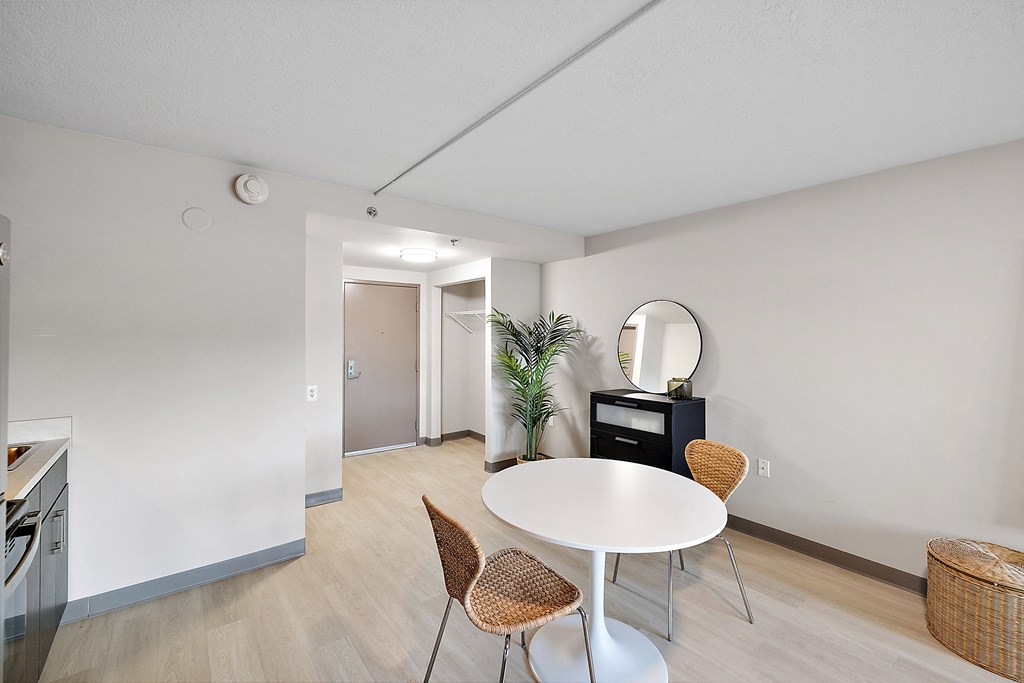 a dining area with a table and chairs at The Block at Sterling Heights, Sterling Heights