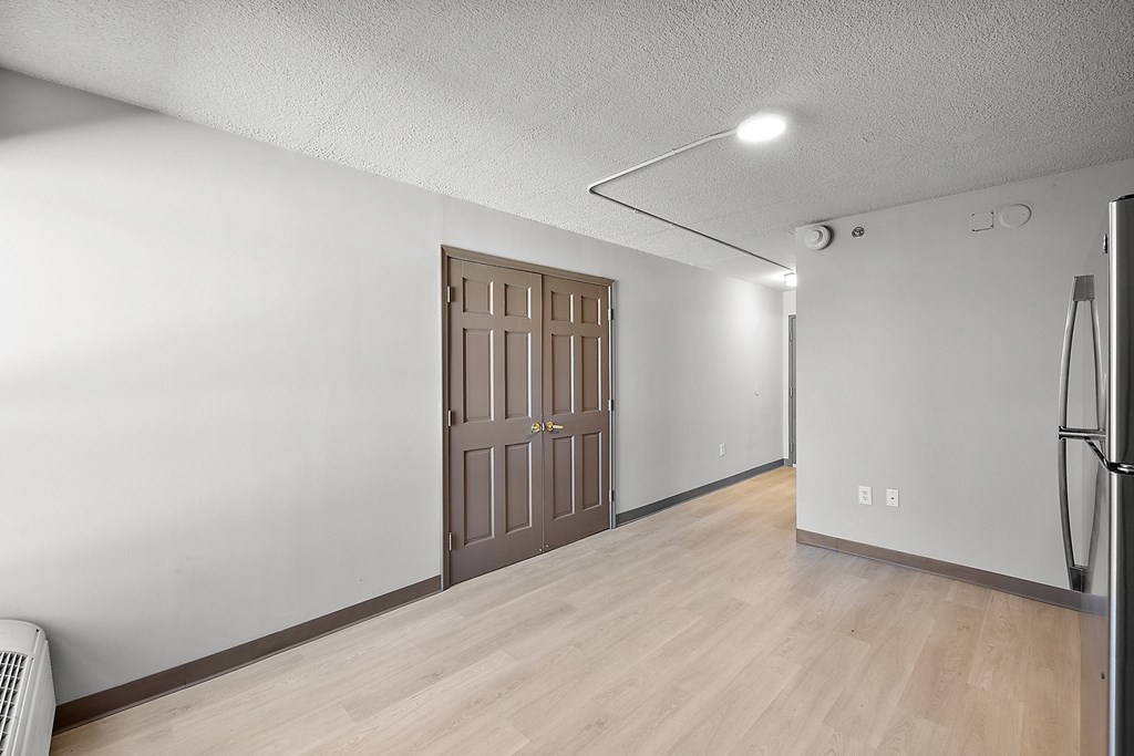 an empty room with a door in the middle of it