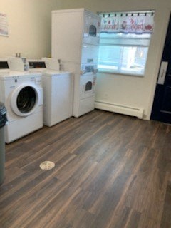 a laundry room with washes and dryers in it
