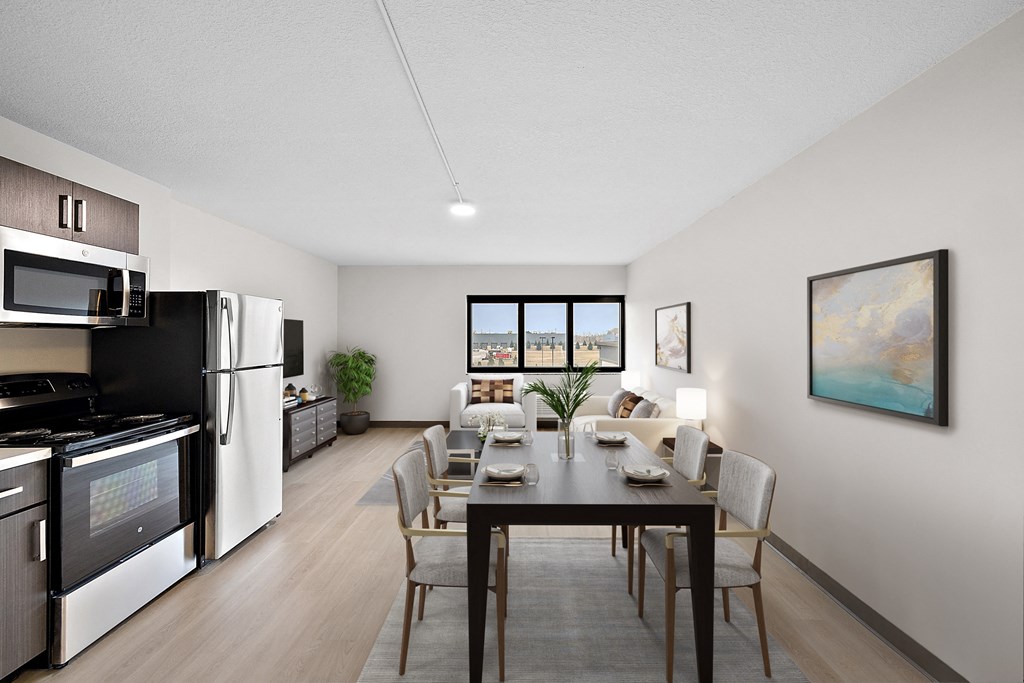 a kitchen and dining area in a 555 waverly unit at The Block at Sterling Heights, Sterling Heights, Michigan