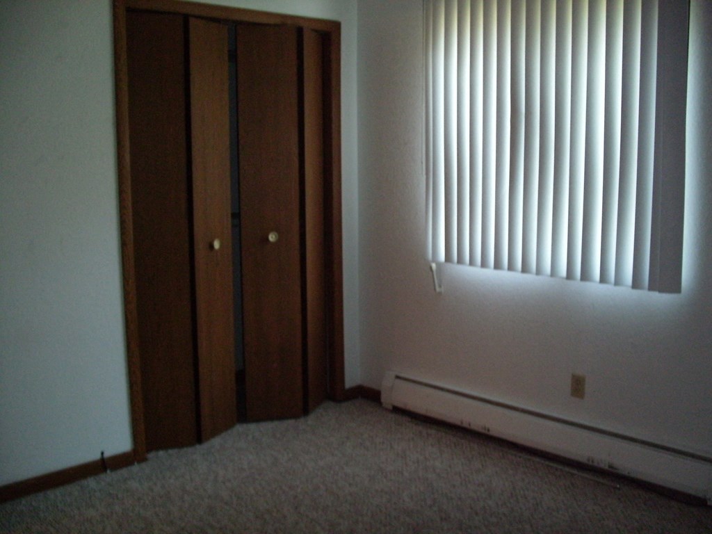 a room with two doors and a window