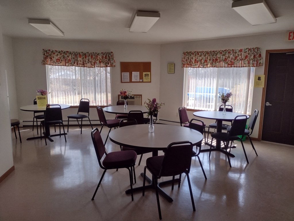 a large room with tables and chairs