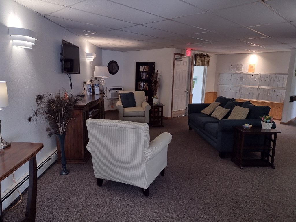 a living room filled with furniture and a flat screen tv