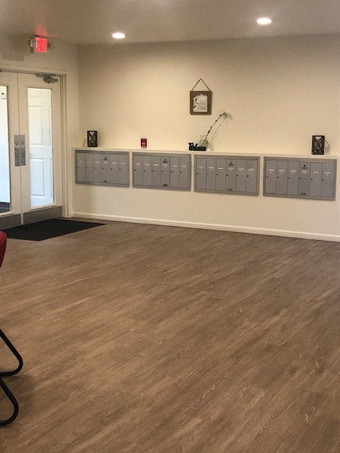 an empty room with a row of lockers on the wall