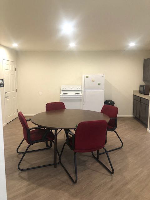 a dining room with a table and chairs