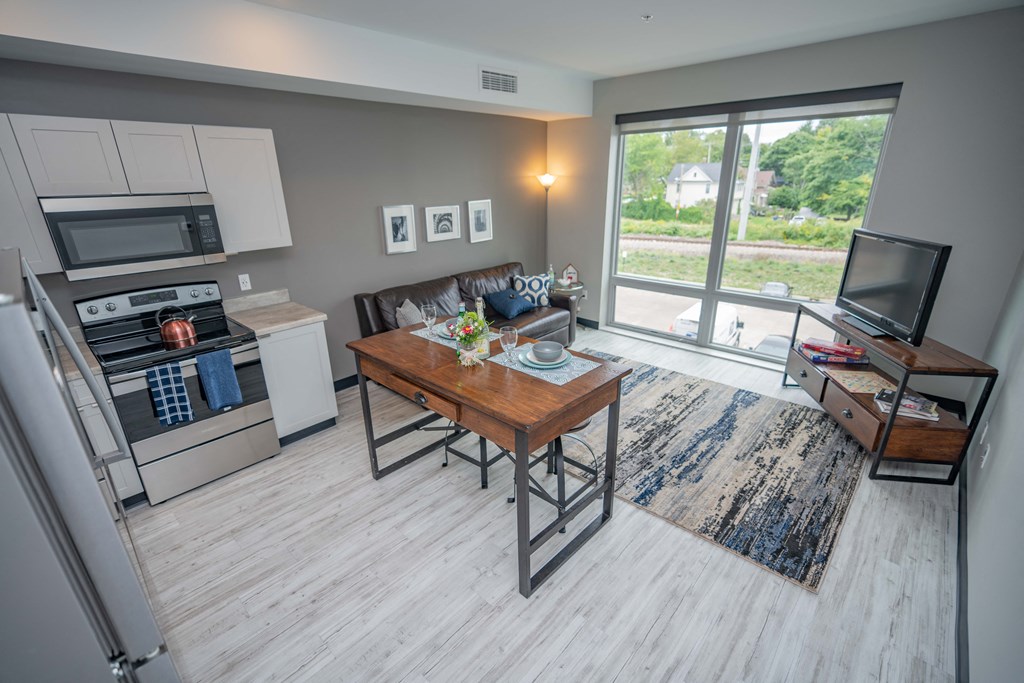 a kitchen and living room in a 555 waverly unit