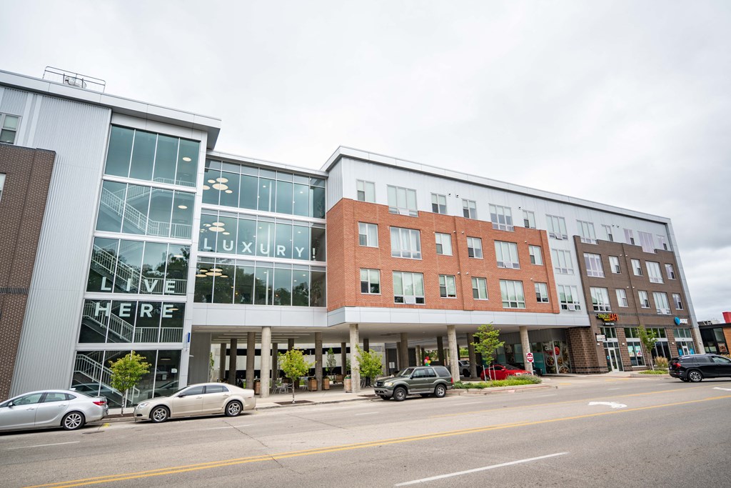a view of the front of the building with cars parked in front of it