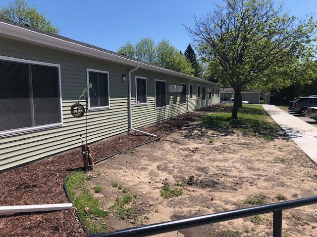 an empty yard in front of a modular building
