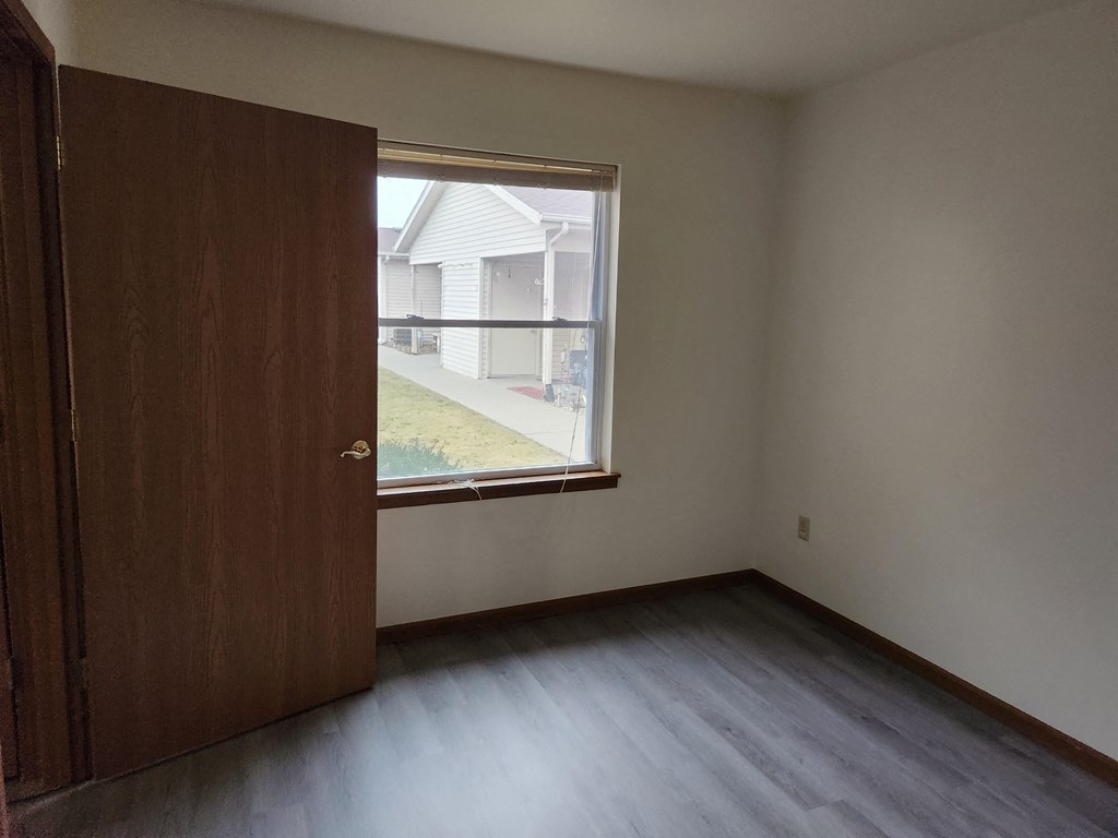 room in a large house with garden and fireplace