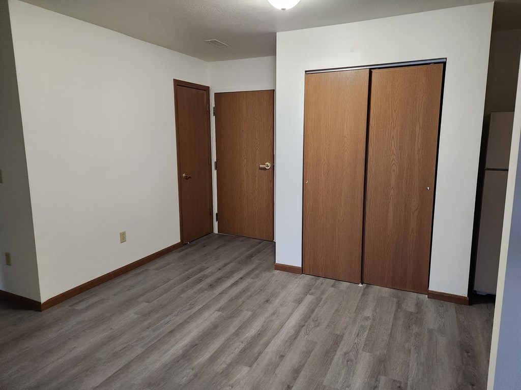 an empty room with two doors