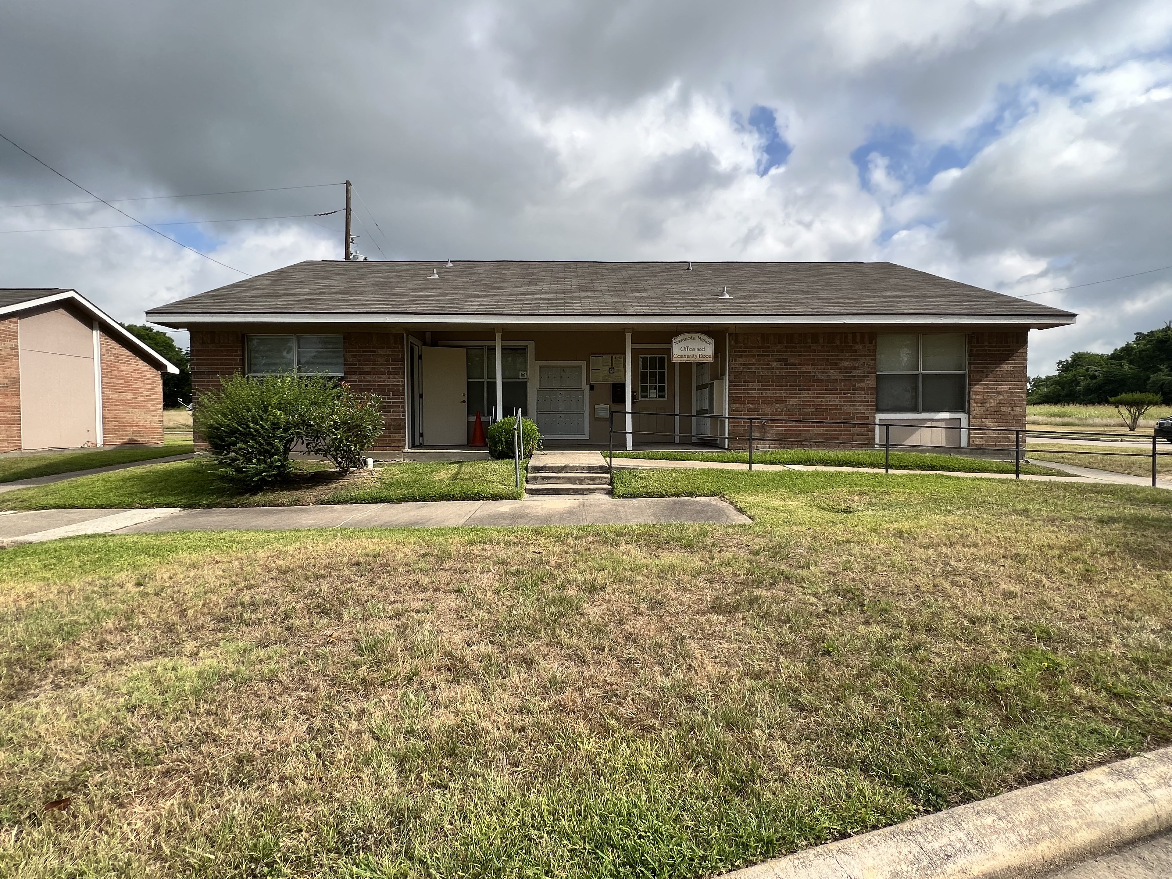 a house with a grassy yard in front of it