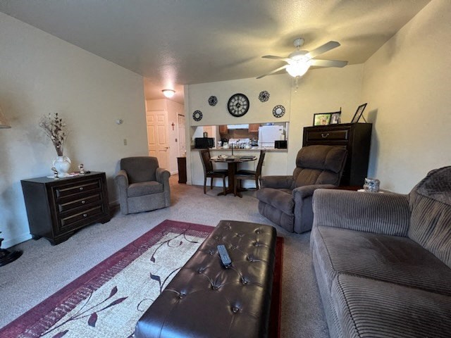 a living room with a couch a chair and a table