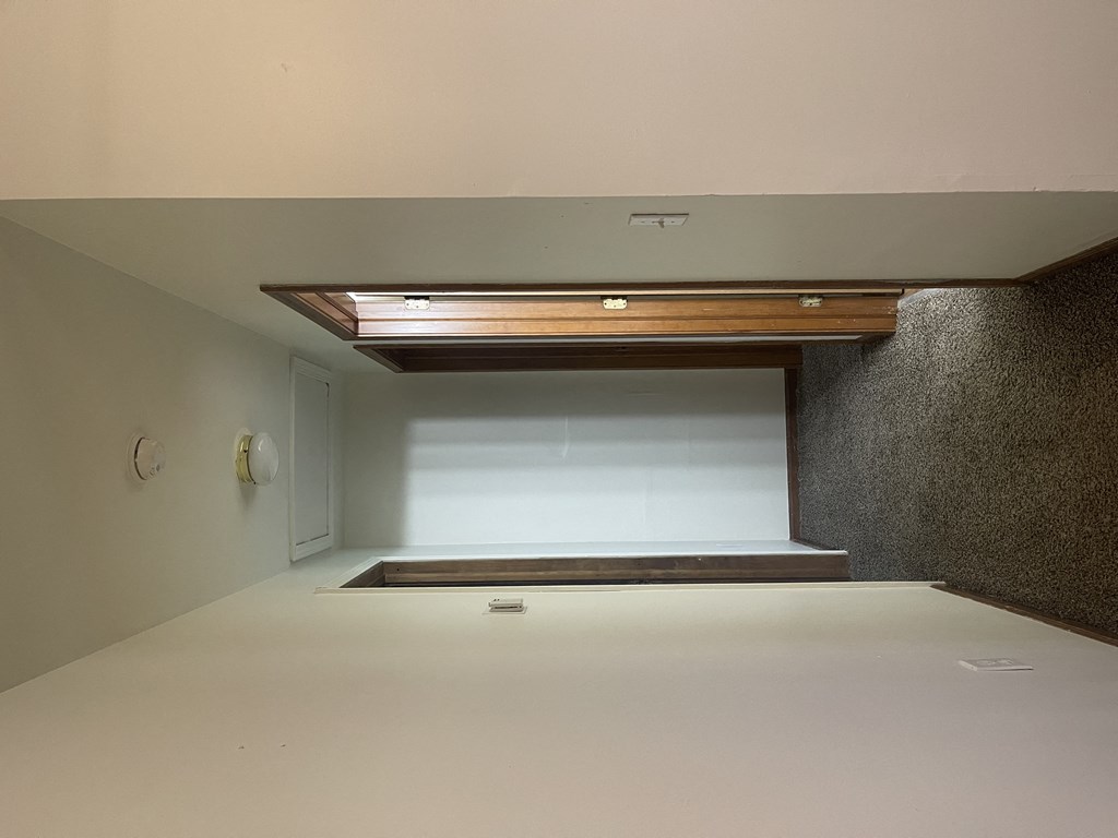 a view of the loft from the top of the stairs