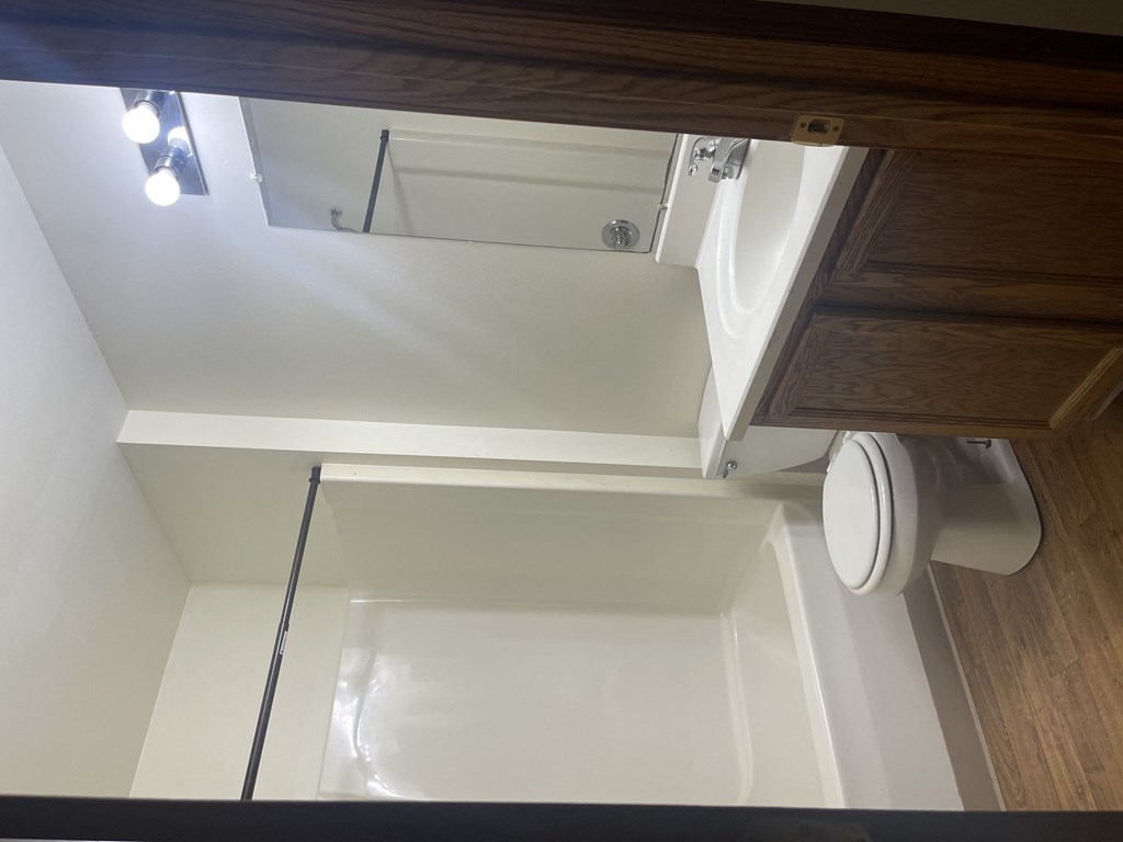 an overhead view of a bathroom with a toilet and sink