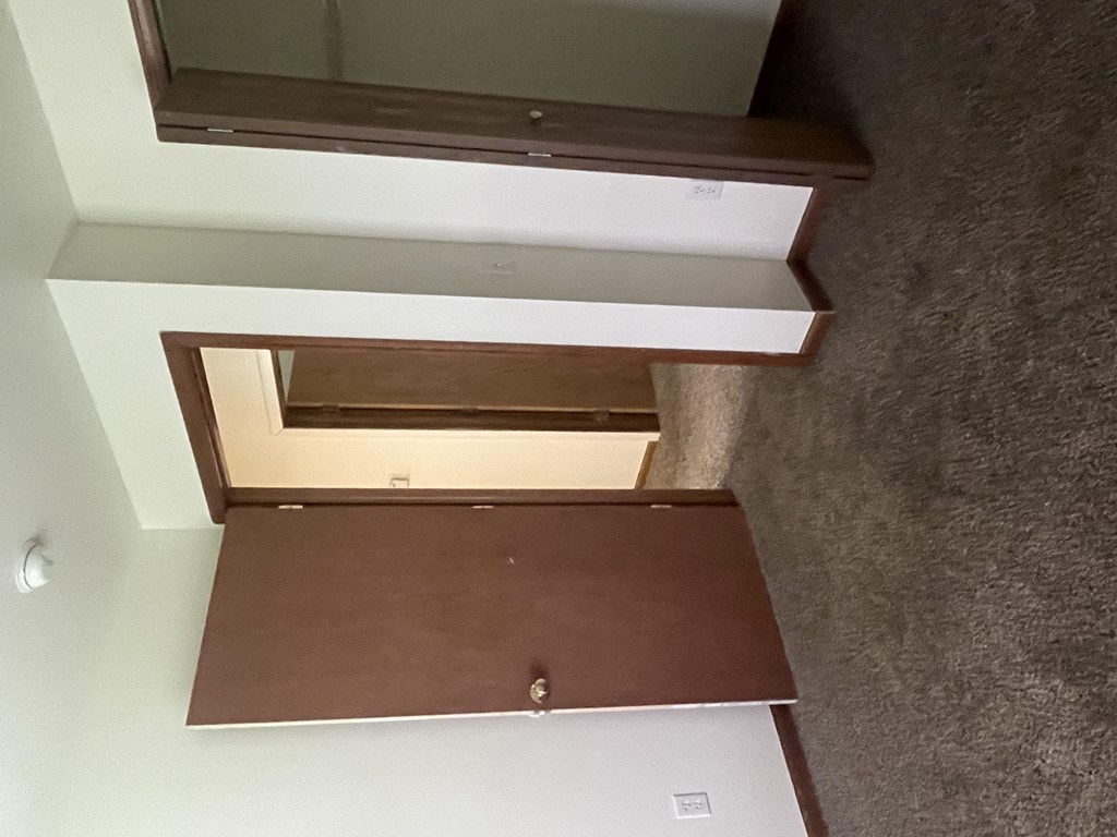 an open drawer with a mirror on top of it