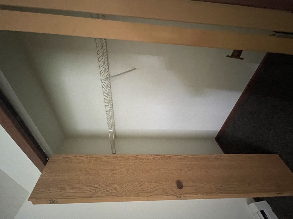 a piece of wood with a measuring tape on top of it