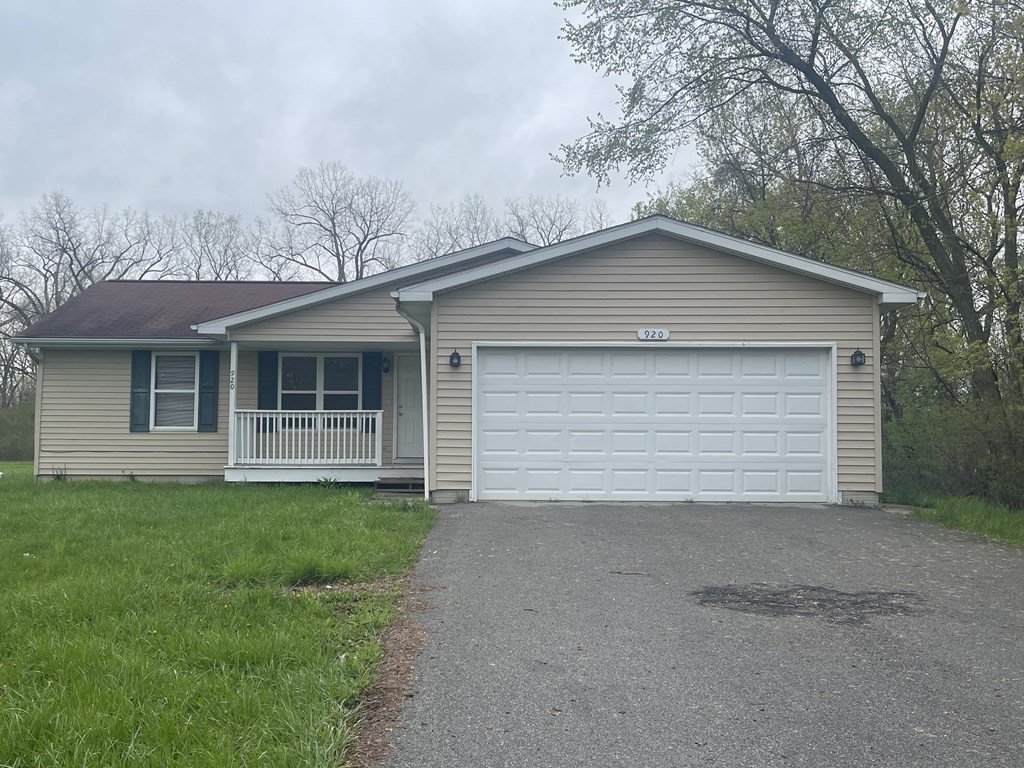 a home with a white garage door