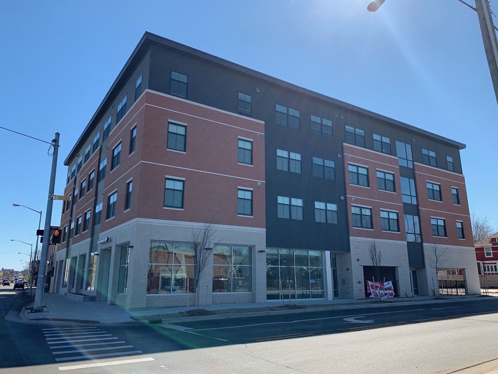 a brick building on the corner of a city street
