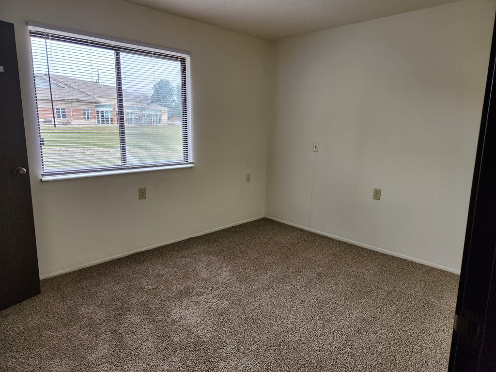 an empty room with a large window